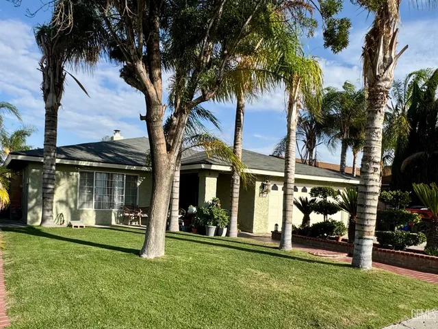front view of a house with a garden