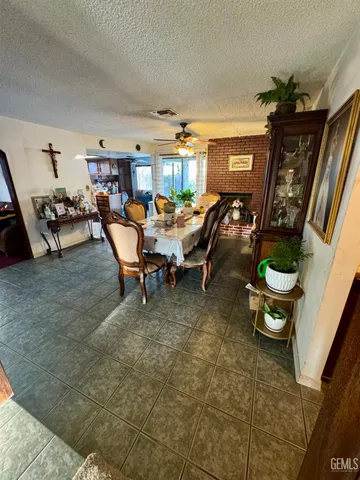 a kitchen with stainless steel appliances kitchen island granite countertop a stove a sink and a microwave