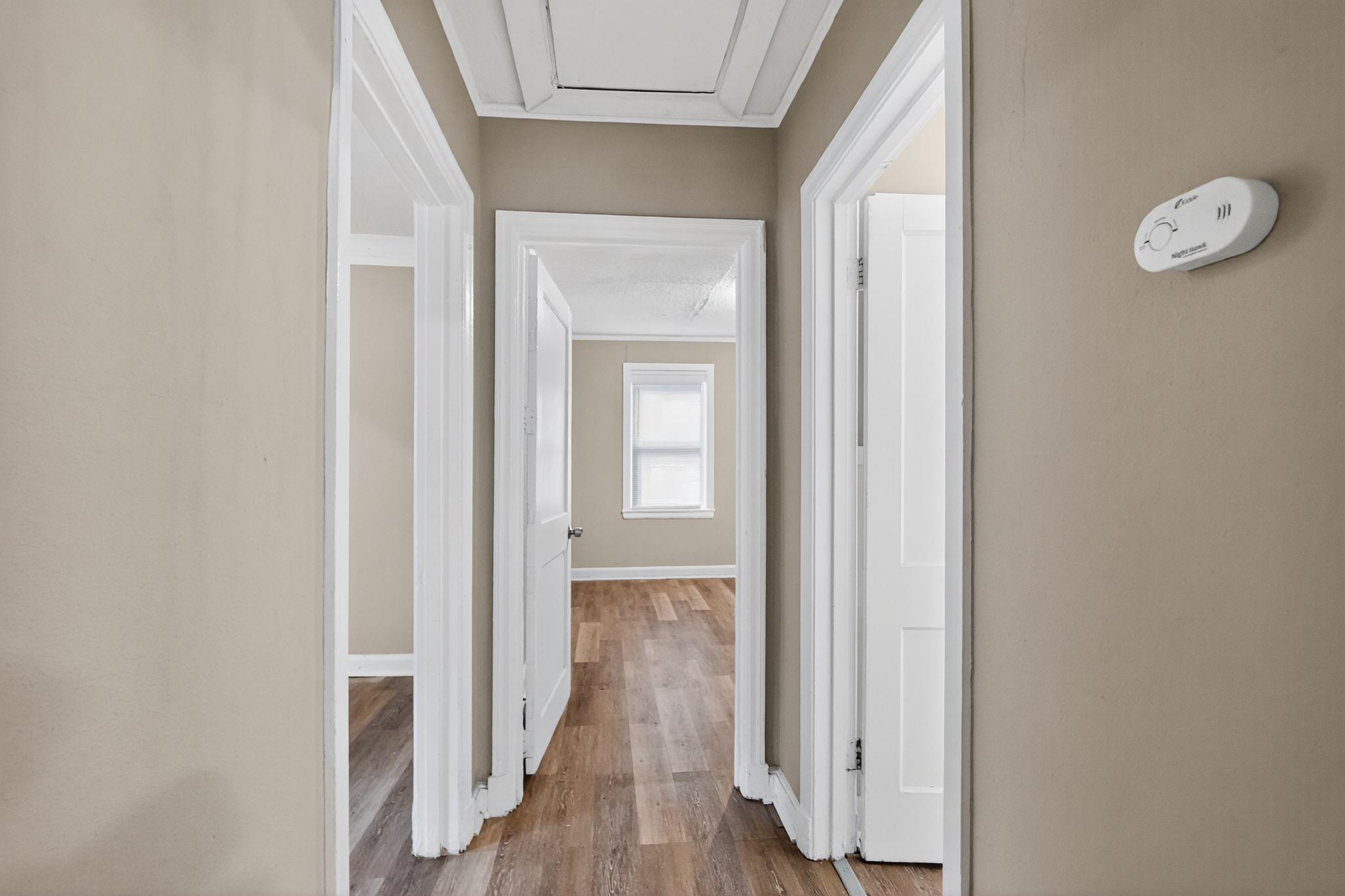 356 Hewlett Road Memphis, TN 38109 - Photo 28 of 30 a view of a hallway with wooden floor