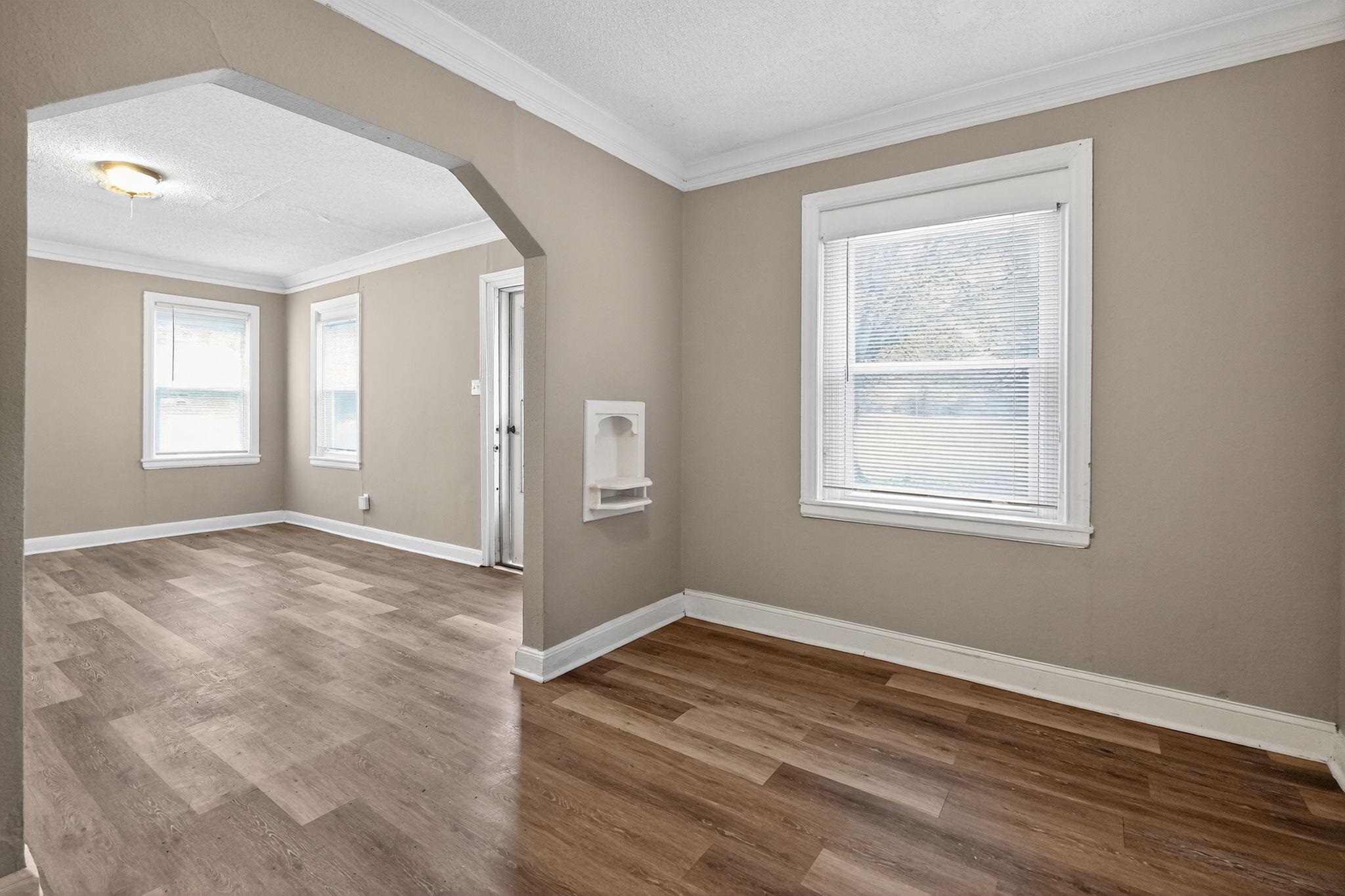 356 Hewlett Road Memphis, TN 38109 - Photo 7 of 30 a view of empty room with wooden floor and fan