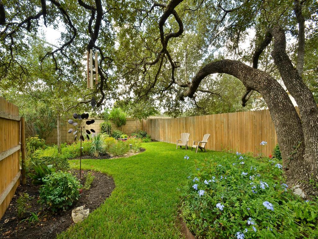 11000 Anderson Mill Road, Unit 93 Austin, TX 78750 - Photo 26 of 27 Mature trees and lush landscaping provide natural serenity in this private backyard oasis.