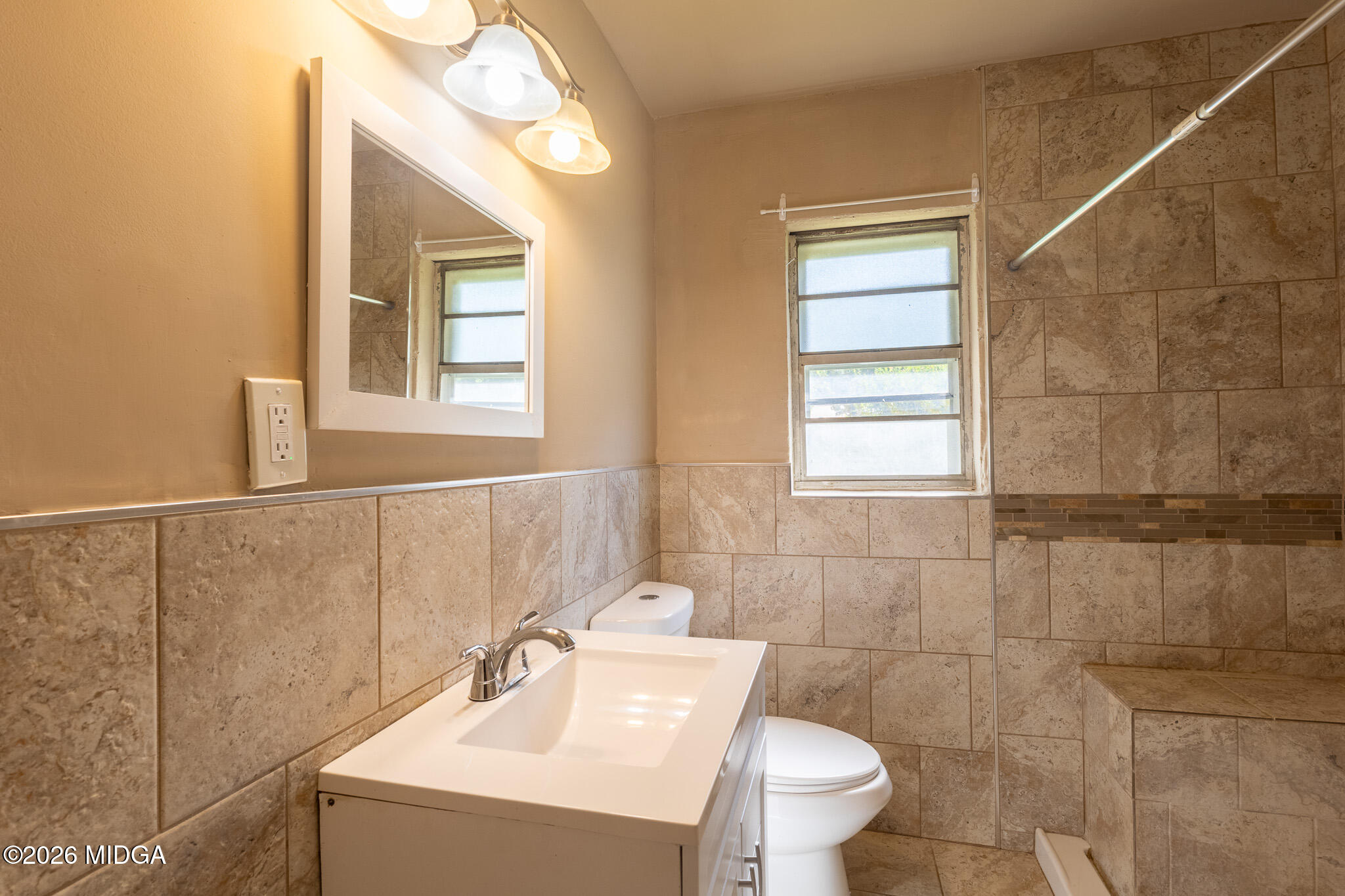 347 Peavy Street Unadilla, GA 31091 - Photo 11 of 15 a bathroom with a sink a toilet and a mirror