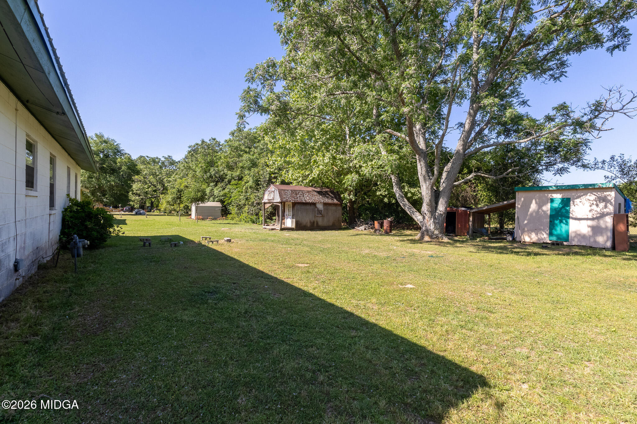 347 Peavy Street Unadilla, GA 31091 - Photo 14 of 15 a view of a house with swimming pool