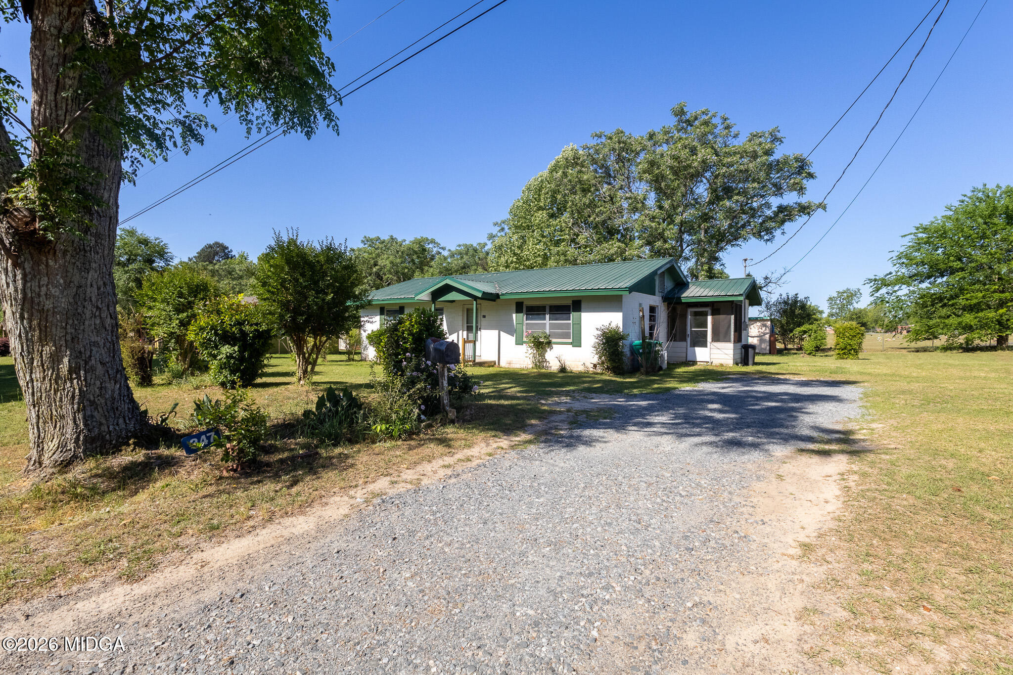 347 Peavy Street Unadilla, GA 31091 - Photo 2 of 15 a front view of a house with a yard