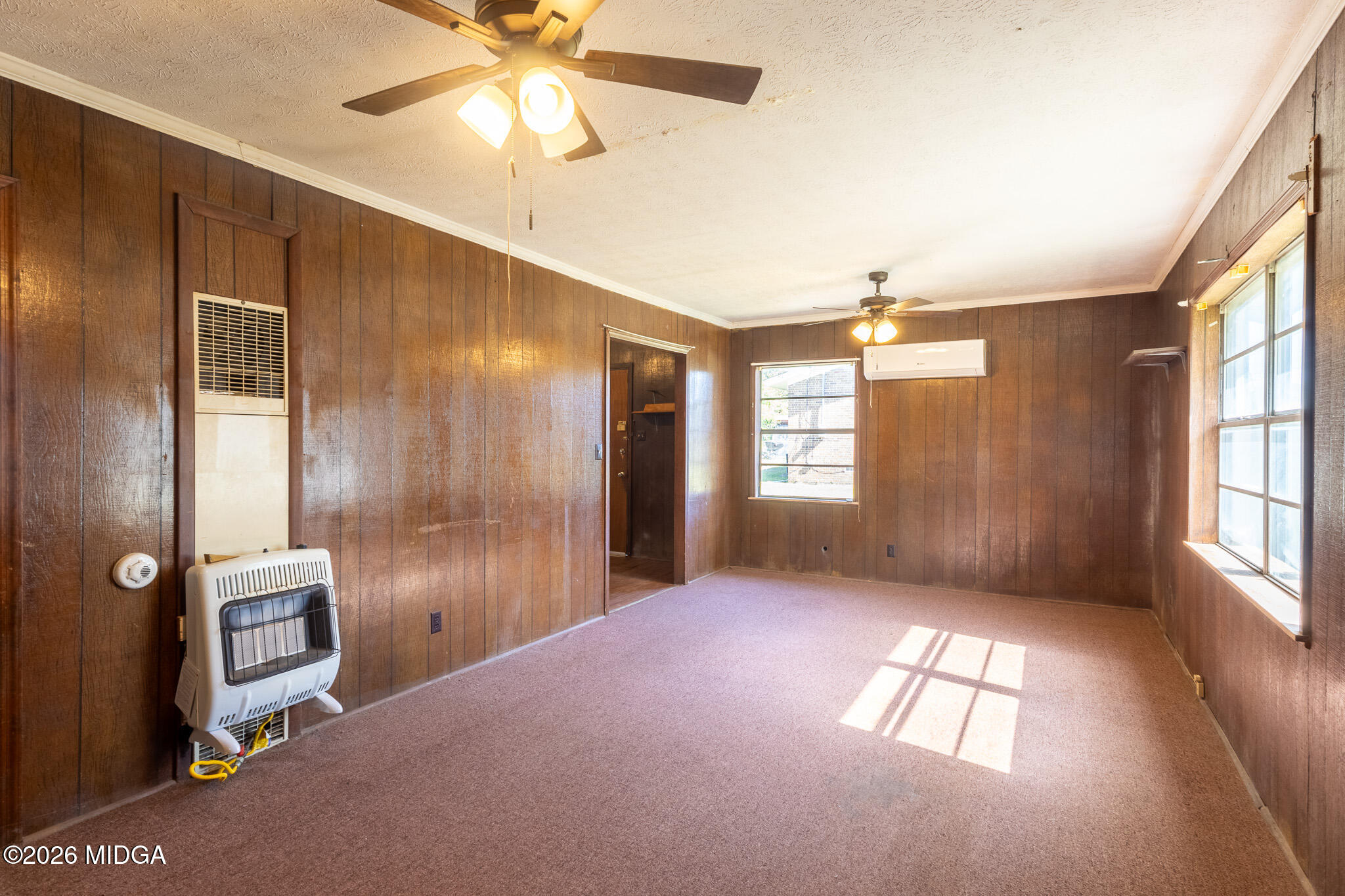 347 Peavy Street Unadilla, GA 31091 - Photo 4 of 15 a view of livingroom with window and ceiling fan