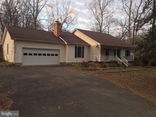 147 Morton Road Fredericksburg, VA 22405 - Photo 1 of 11 a front view of a house with garden