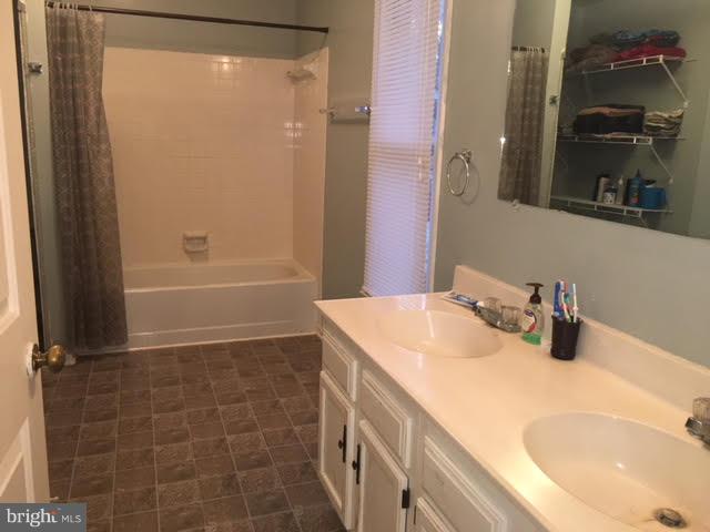 147 Morton Road Fredericksburg, VA 22405 - Photo 8 of 11 a bathroom with a sink a vanity and a mirror