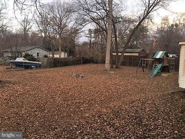 147 Morton Road Fredericksburg, VA 22405 - Photo 10 of 11 a backyard of a house with table and chairs