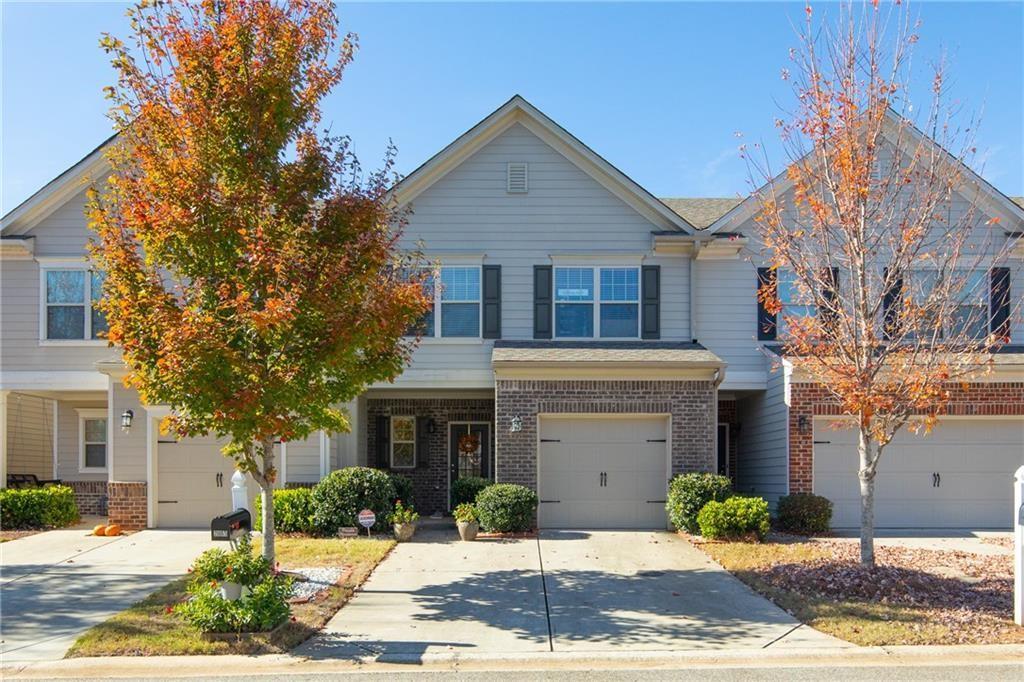 2865 Maple Park Place, Unit 44 Cumming, GA 30041 - Photo 1 of 18 a front view of a house with a yard