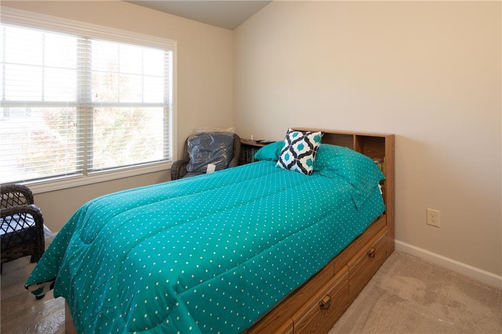 2865 Maple Park Place, Unit 44 Cumming, GA 30041 - Photo 12 of 18 a bedroom with a bed and a window