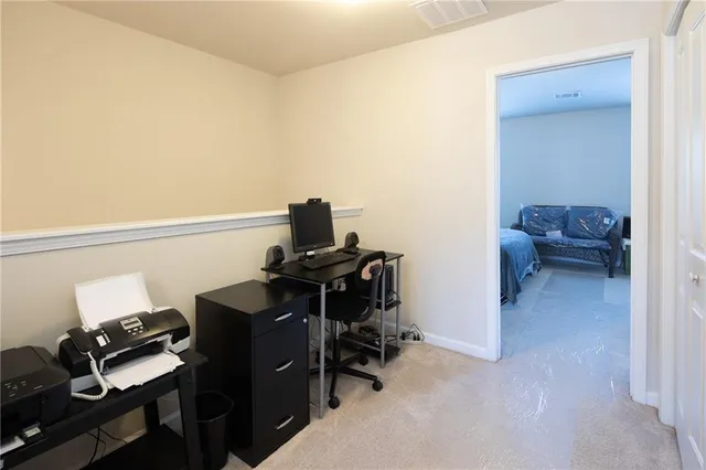 a view of workspace with wooden floor