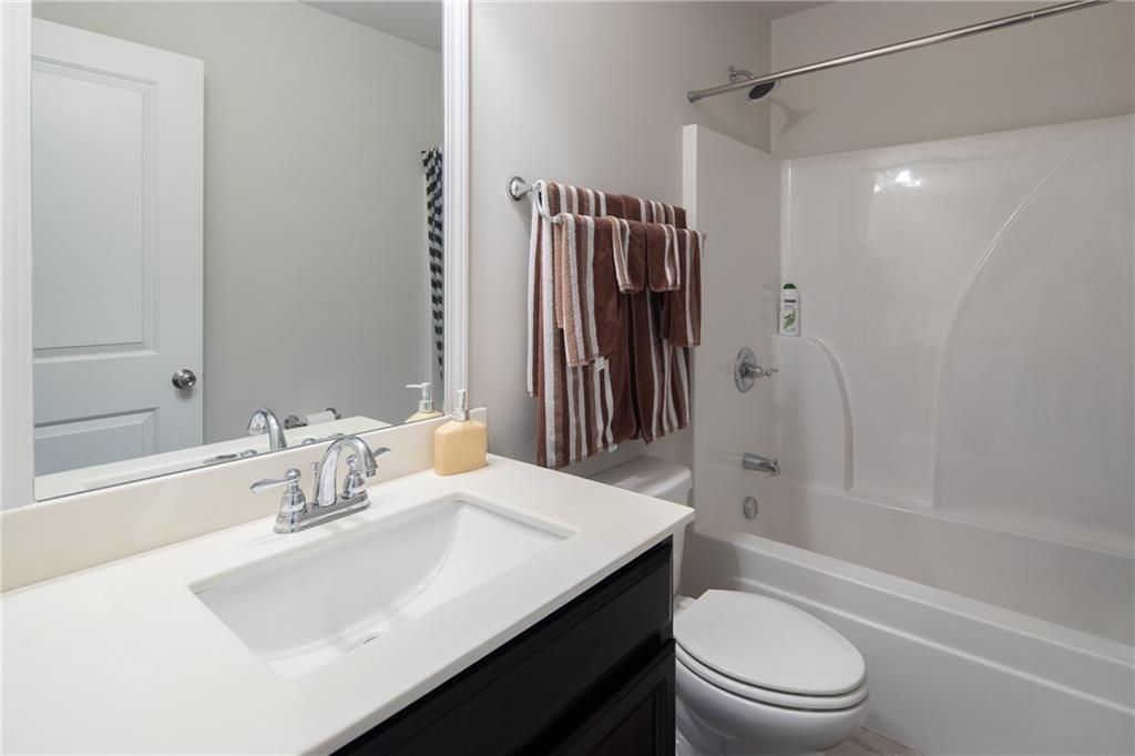 2865 Maple Park Place, Unit 44 Cumming, GA 30041 - Photo 17 of 18 a bathroom with a sink toilet tub and shower