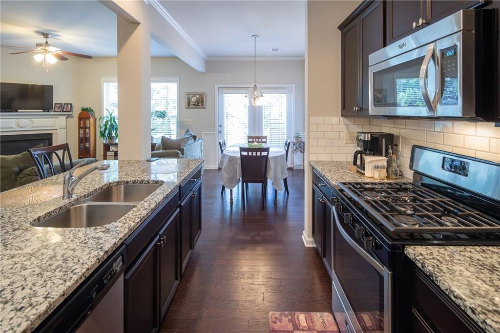 2865 Maple Park Place, Unit 44 Cumming, GA 30041 - Photo 5 of 18 a kitchen with granite countertop lots of counter top space