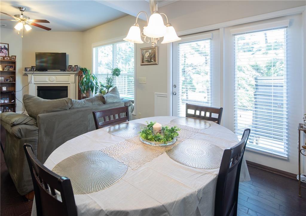 2865 Maple Park Place, Unit 44 Cumming, GA 30041 - Photo 9 of 18 a view of a dining room with furniture window and wooden floor
