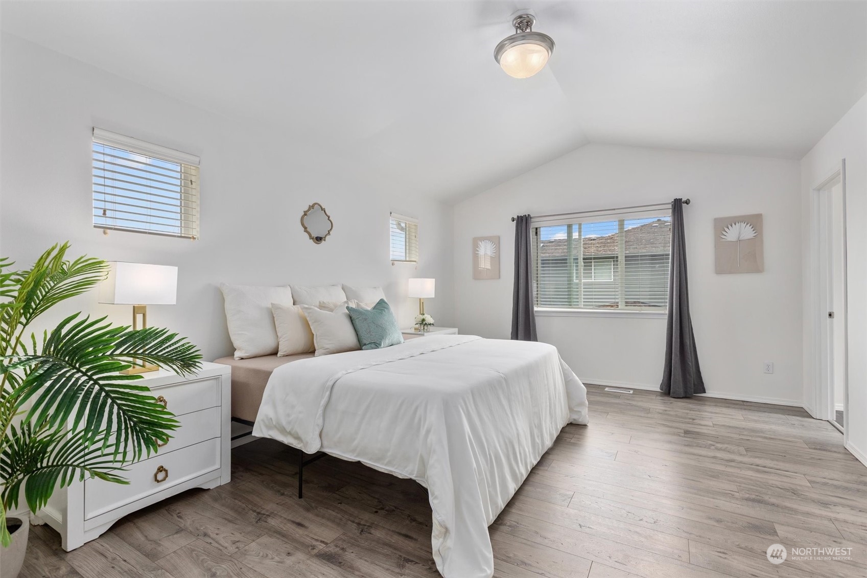 4501 146th Street Southeast Bothell, WA 98012 - Photo 12 of 39 a bedroom with bed and a potted plant