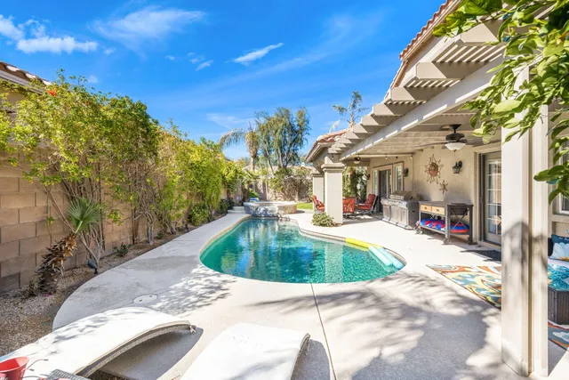 a living room filled with furniture and a table