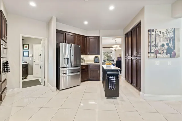 a kitchen with a sink and a stove top oven