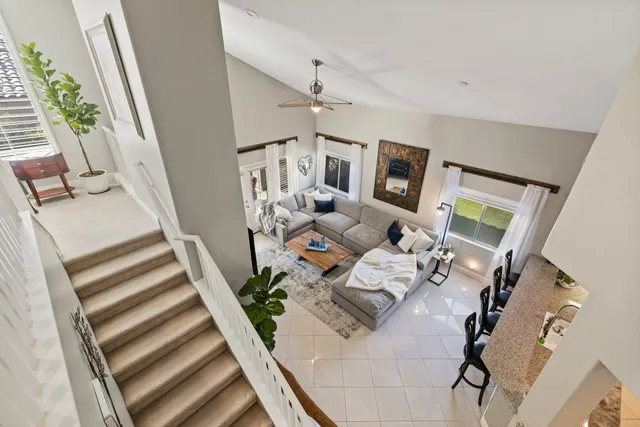 an aerial view of residential house with outdoor space and trees