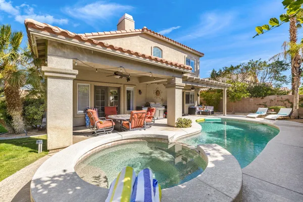 a view of a house with swimming pool patio