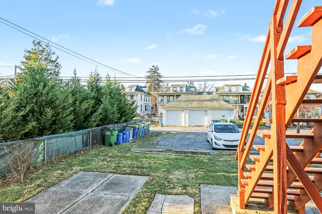 a view of an house with backyard porch and hardwood
