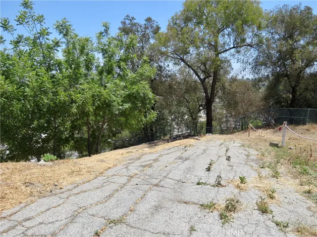 a view of a yard covered with snow in front of house