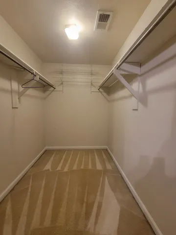 a view of a room with racks on the wall