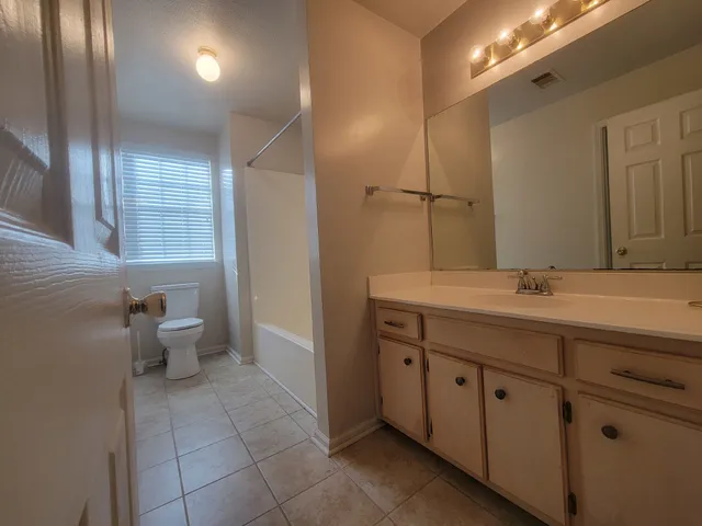 a view of backyard with green space