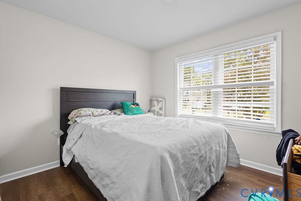 829 Rome Street Petersburg, VA 23803 - Photo 15 of 20 a bed sitting in a bedroom next to a window