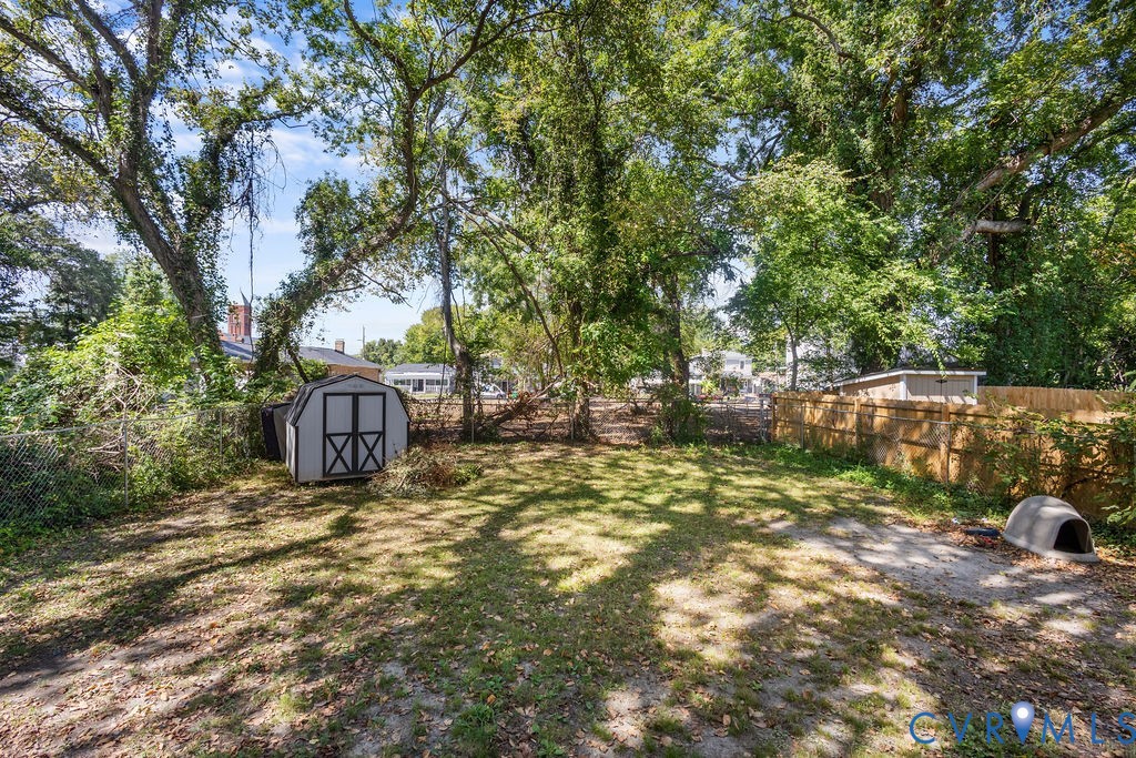 829 Rome Street Petersburg, VA 23803 - Photo 19 of 20 a view of a yard with large trees