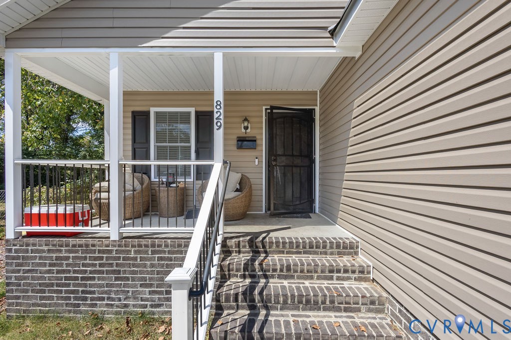 829 Rome Street Petersburg, VA 23803 - Photo 3 of 20 a view of a patio with a table and chairs