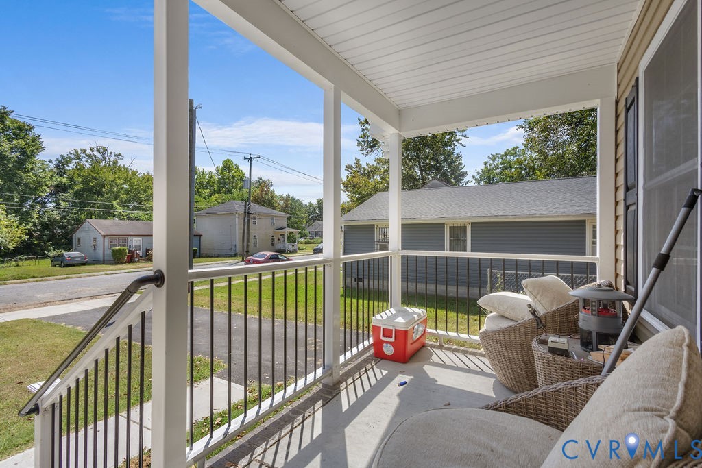 829 Rome Street Petersburg, VA 23803 - Photo 4 of 20 a view of two chairs in the balcony