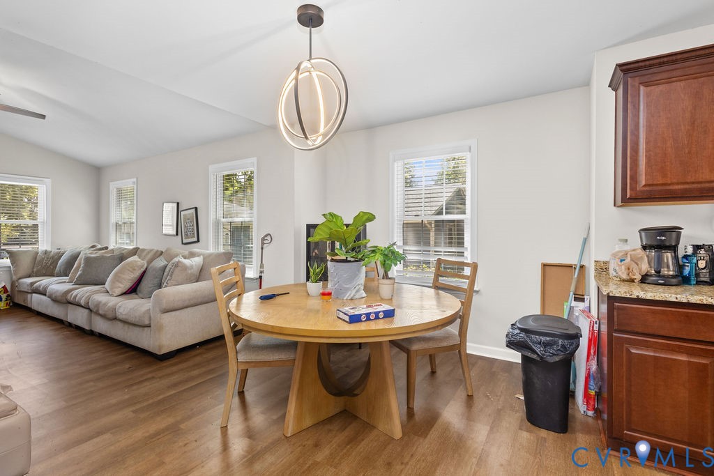 829 Rome Street Petersburg, VA 23803 - Photo 10 of 20 a living room with furniture a chandelier and a dining table