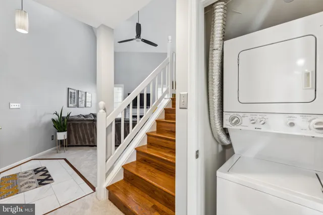 a view of staircase with washer and dryer