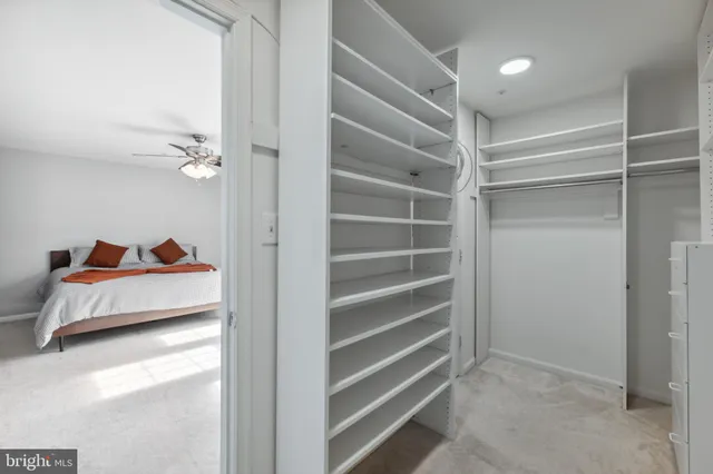 a bedroom with a bed and a cabinets