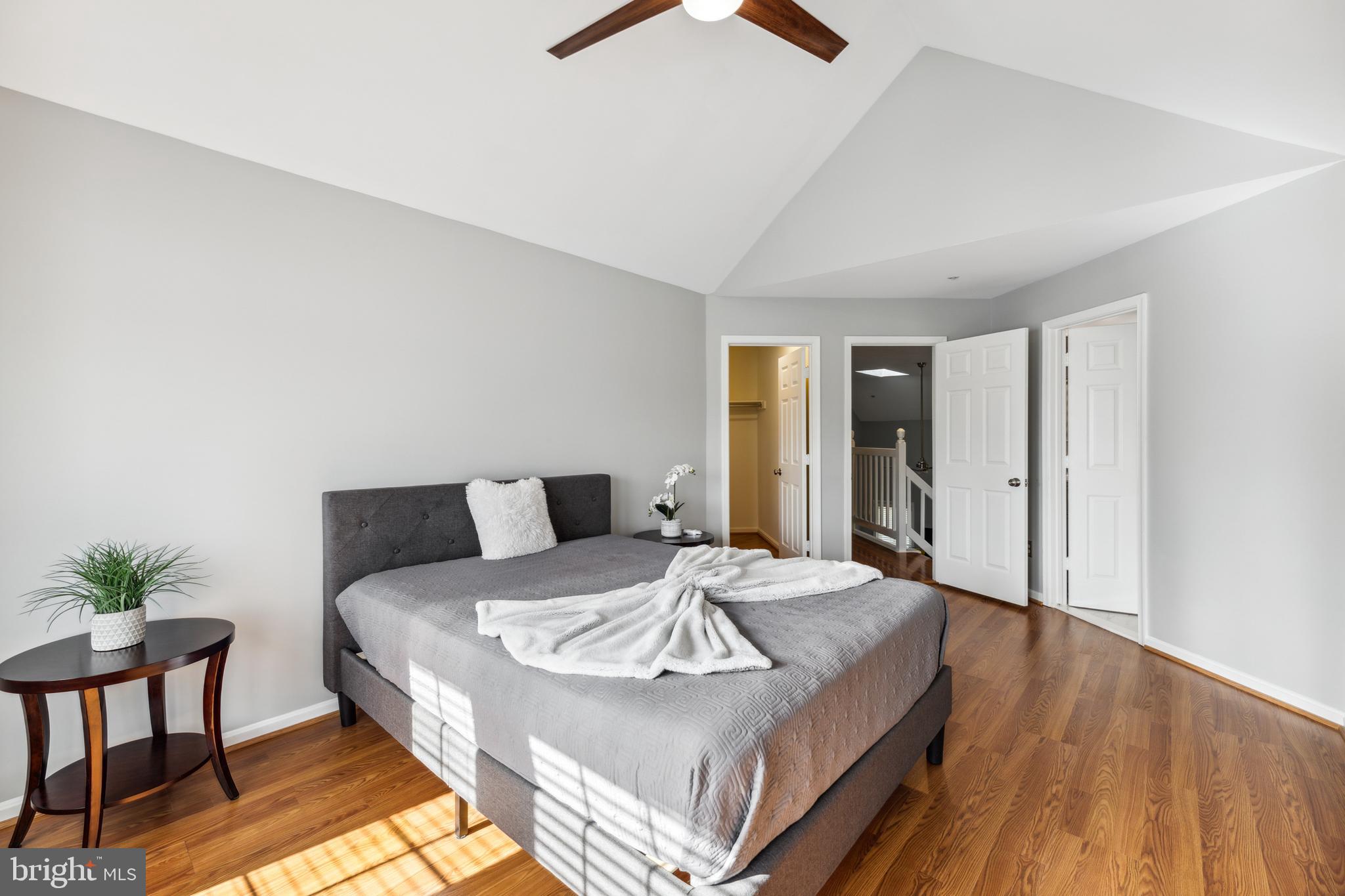 6934F Ellingham Circle Alexandria, VA 22315 - Photo 19 of 34 a bed sitting in a spacious bedroom next to a window