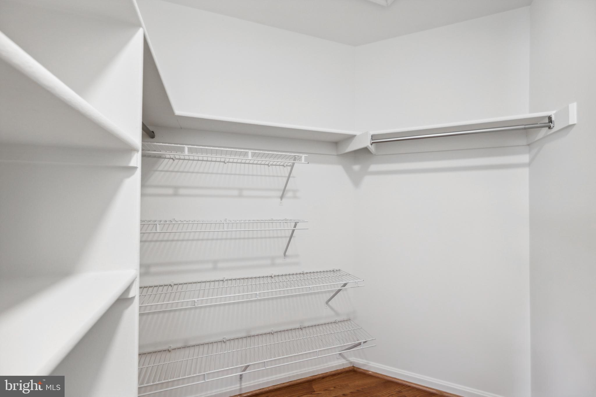 6934F Ellingham Circle Alexandria, VA 22315 - Photo 20 of 34 a view of walk in closet with empty racks