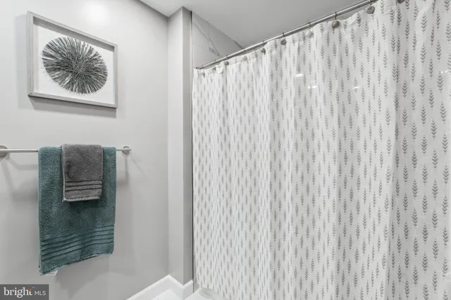 a picture of a bathroom with a shower curtain
