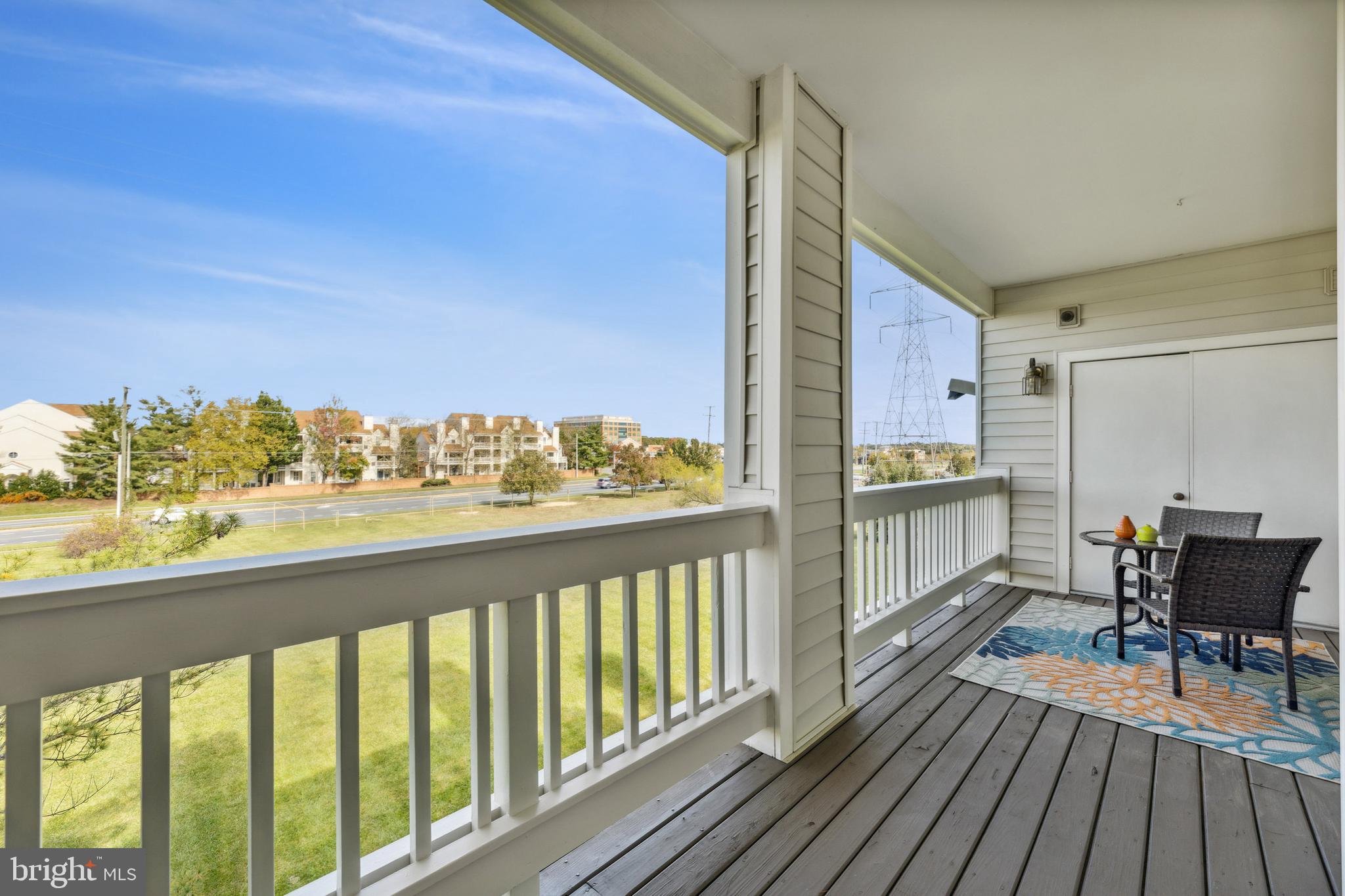 6934F Ellingham Circle Alexandria, VA 22315 - Photo 22 of 34 a view of a balcony with wooden floor