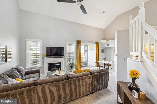 a living room with furniture fireplace and a flat screen tv