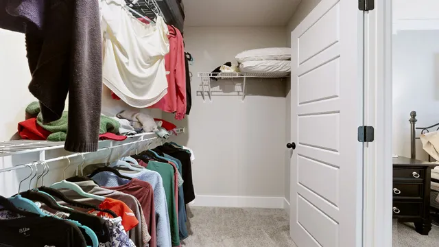 a bathroom with a granite countertop sink toilet and mirror