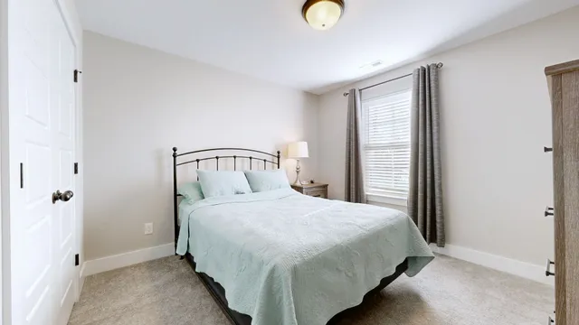 a bedroom with a bed and a cabinets