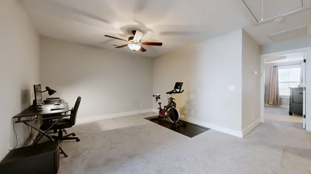 a view of room with gym equipment