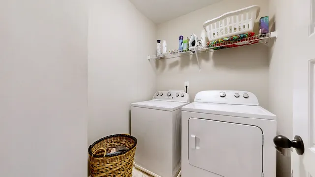 a view of a lounge chairs in back of the house