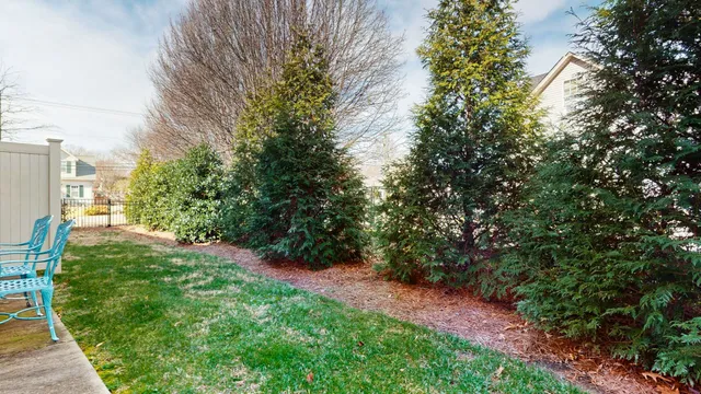 an aerial view of a house with a yard and garden space