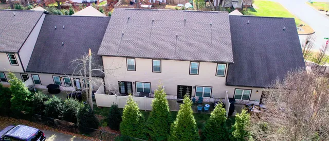 a picture of a room with a white bed