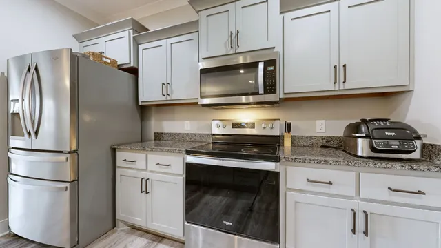 a kitchen with counter top space sink and center island