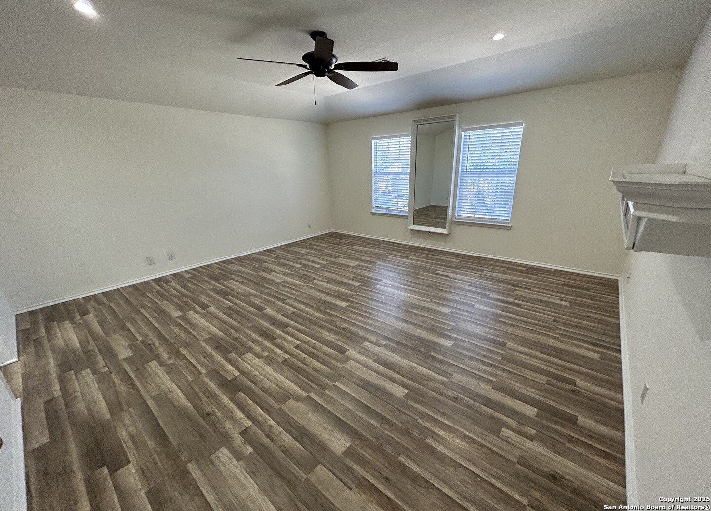 7714 Cold Mountain Converse, TX 78109 - Photo 18 of 27 a view of empty room with wooden floor and fan