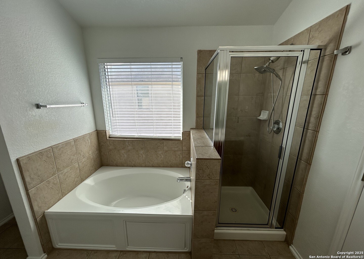 7714 Cold Mountain Converse, TX 78109 - Photo 20 of 27 a bathroom with a bathtub and a shower