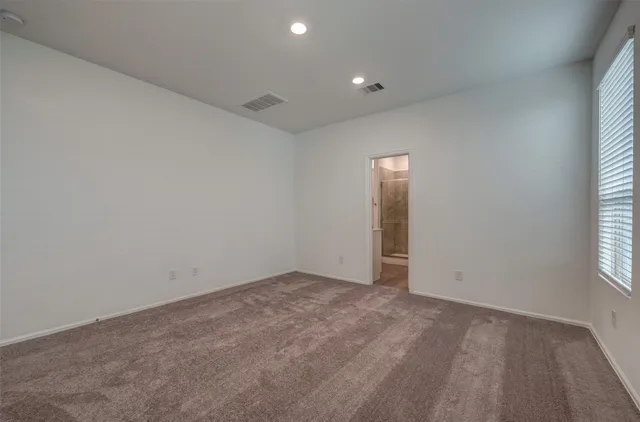 a bathroom with a shower and toilet