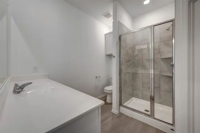 a utility room with cabinets washer and dryer